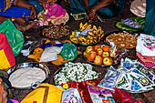 Worship and puja offerings inside the Swamimalai temple. 